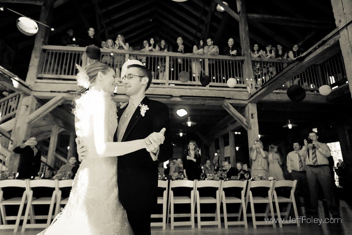 Couple dancing in front of a crowd inside of Pat's Barn.
